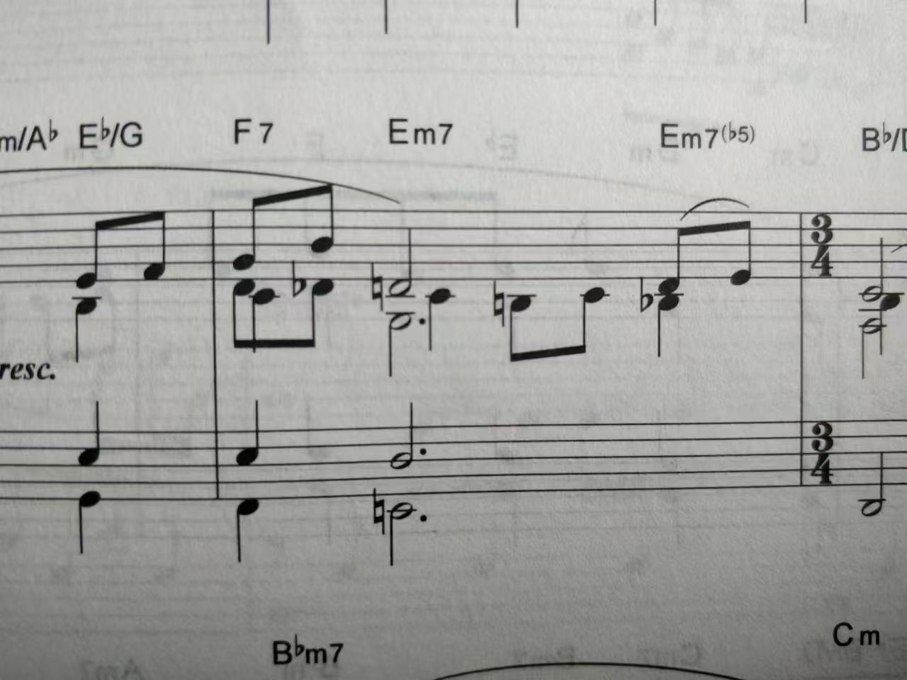 Piano measure with multiple voices overlapping at adjacent horizontal positions.